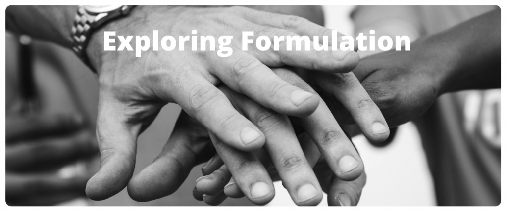A bundle of hands together one on top of the next with the text exploring formulation.