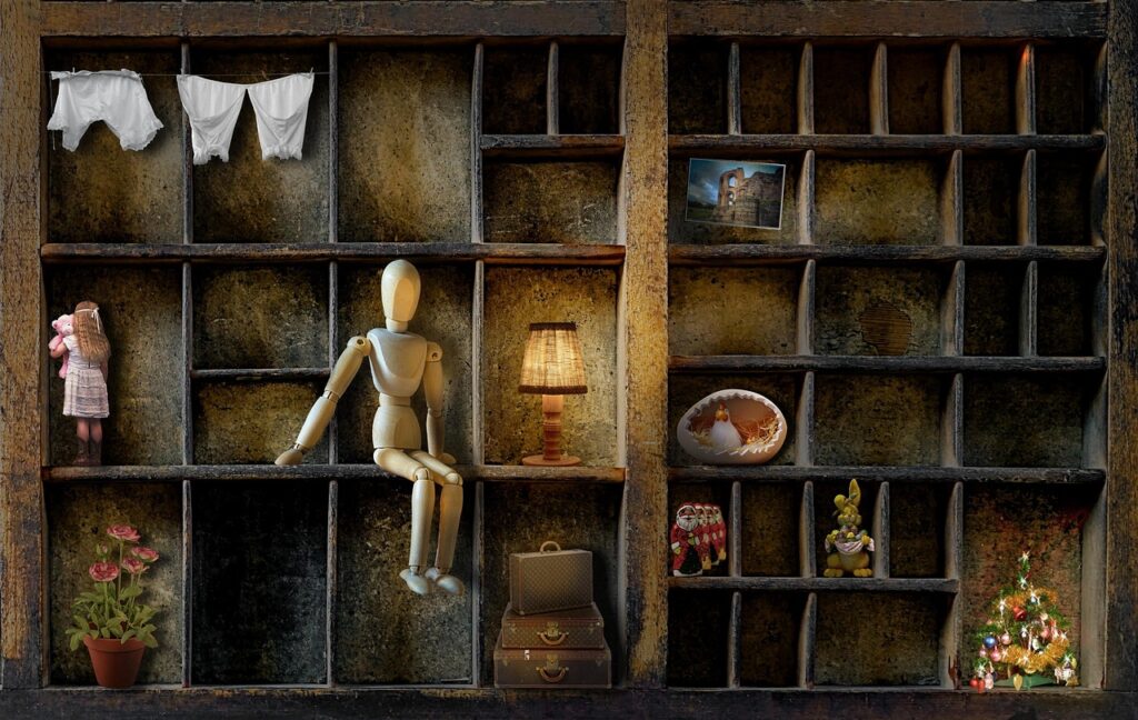 Collection of dolls house items in a display.