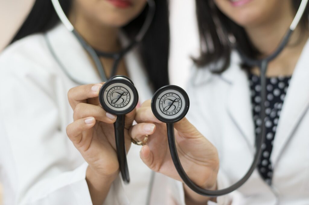Two doctors holding stethoscopes.