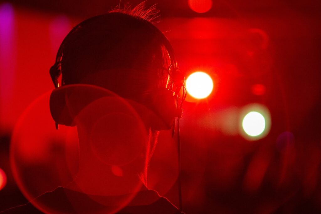 someone with headphones on listening to music.