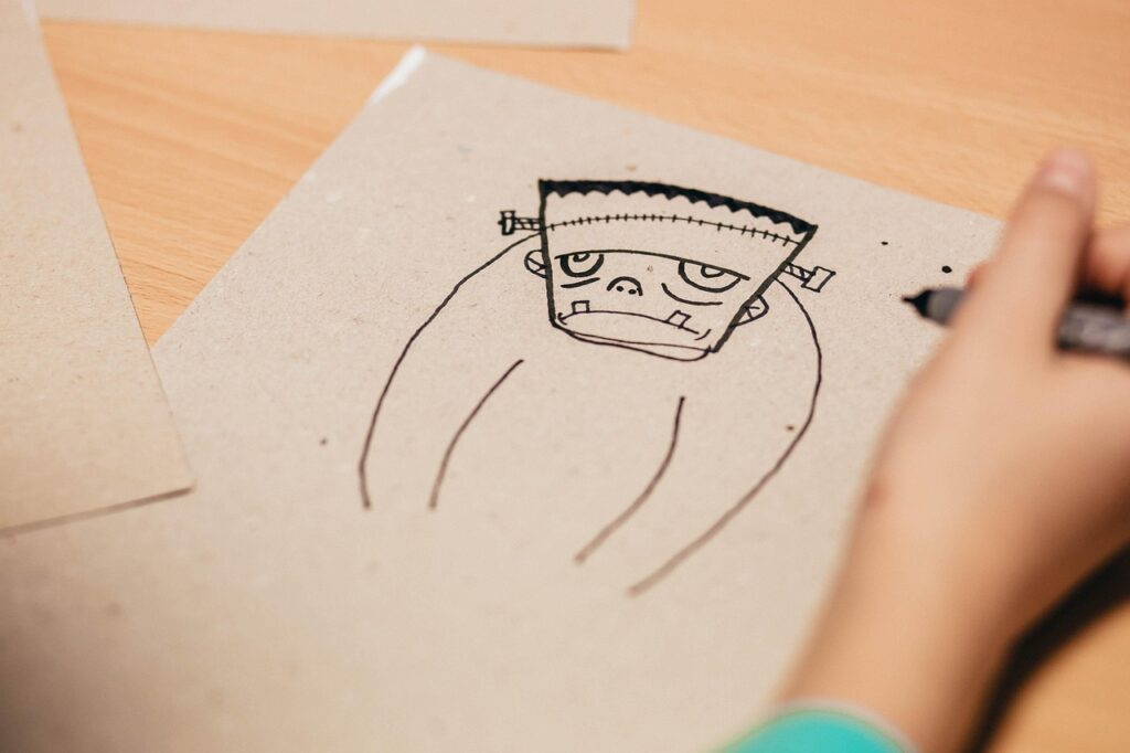 A drawing of a monster on a piece of paper