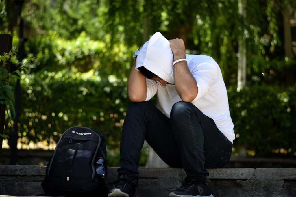 person with their head in their hands
