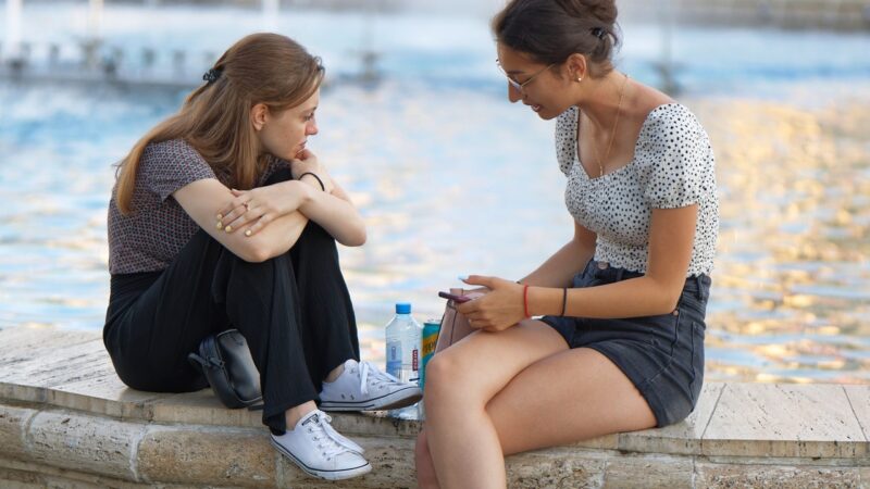 two young people talking