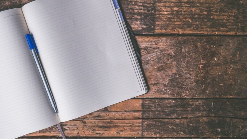 Notebook and pen.