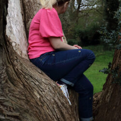 a person sat in a tree
