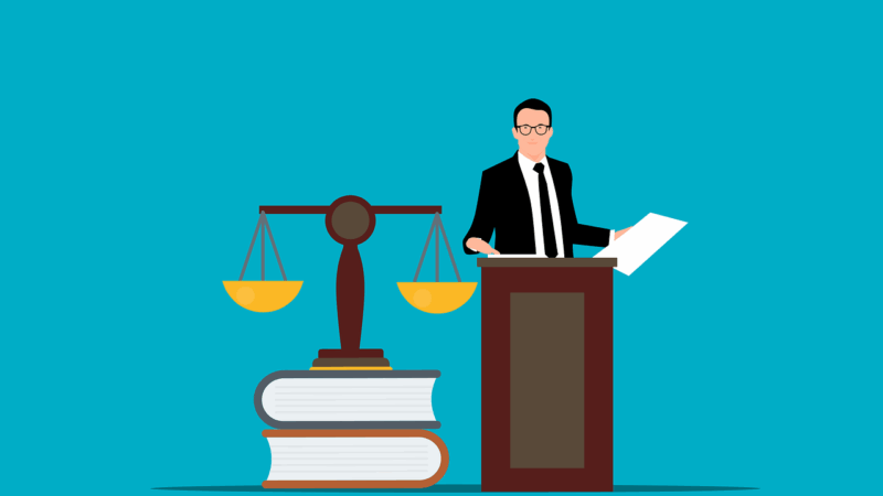law books, an official and the scales of justice.